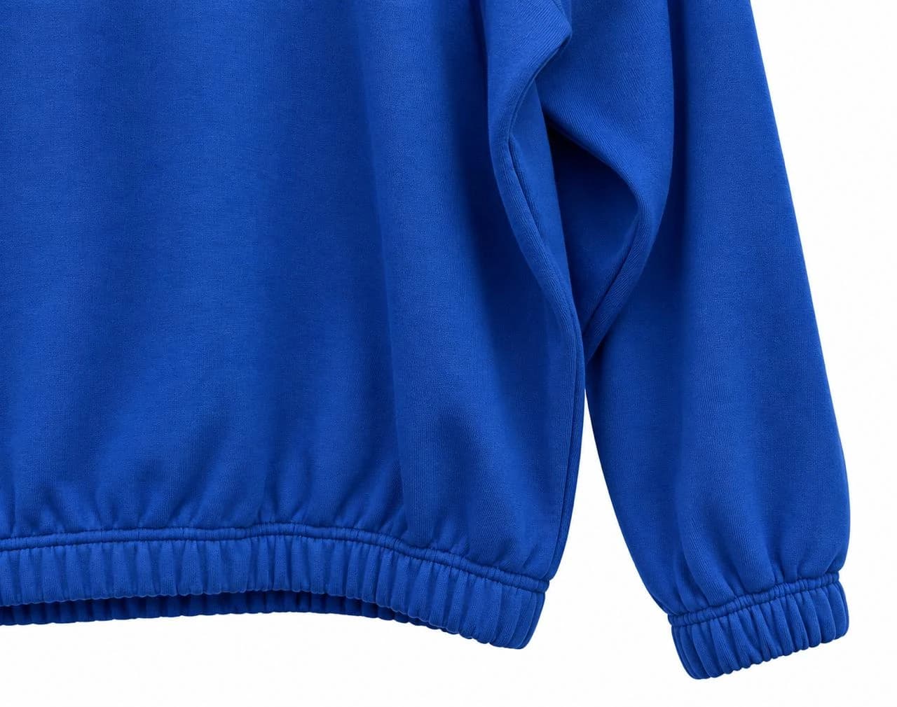 Close-up of the cobalt BERQ sweatshirt sleeve and elasticated hem